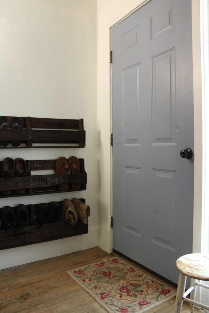 wood pallet shoe rack in entry way