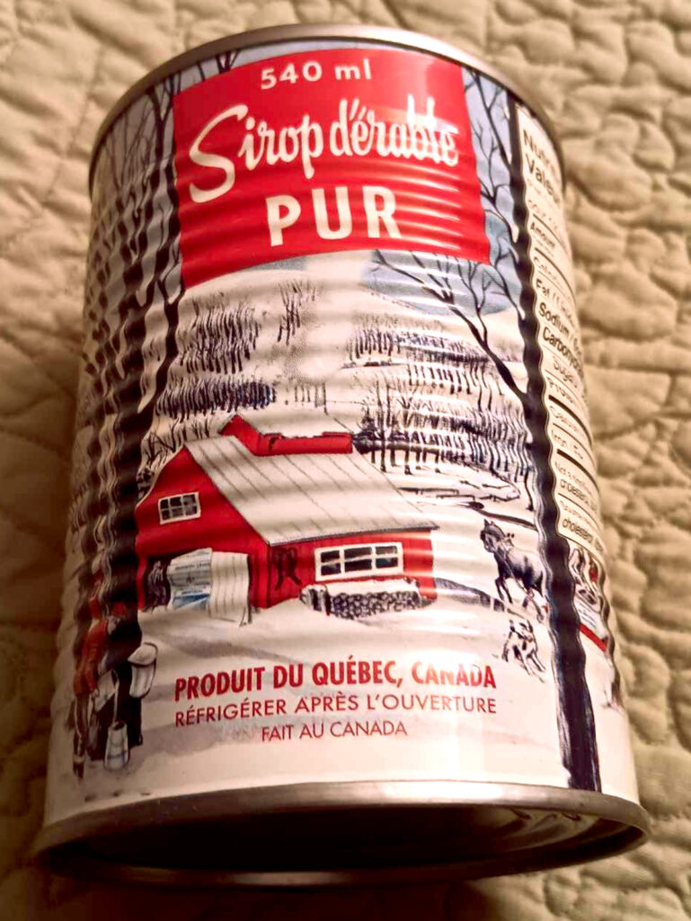 a metal can of maple syrup from Canada with writing in French