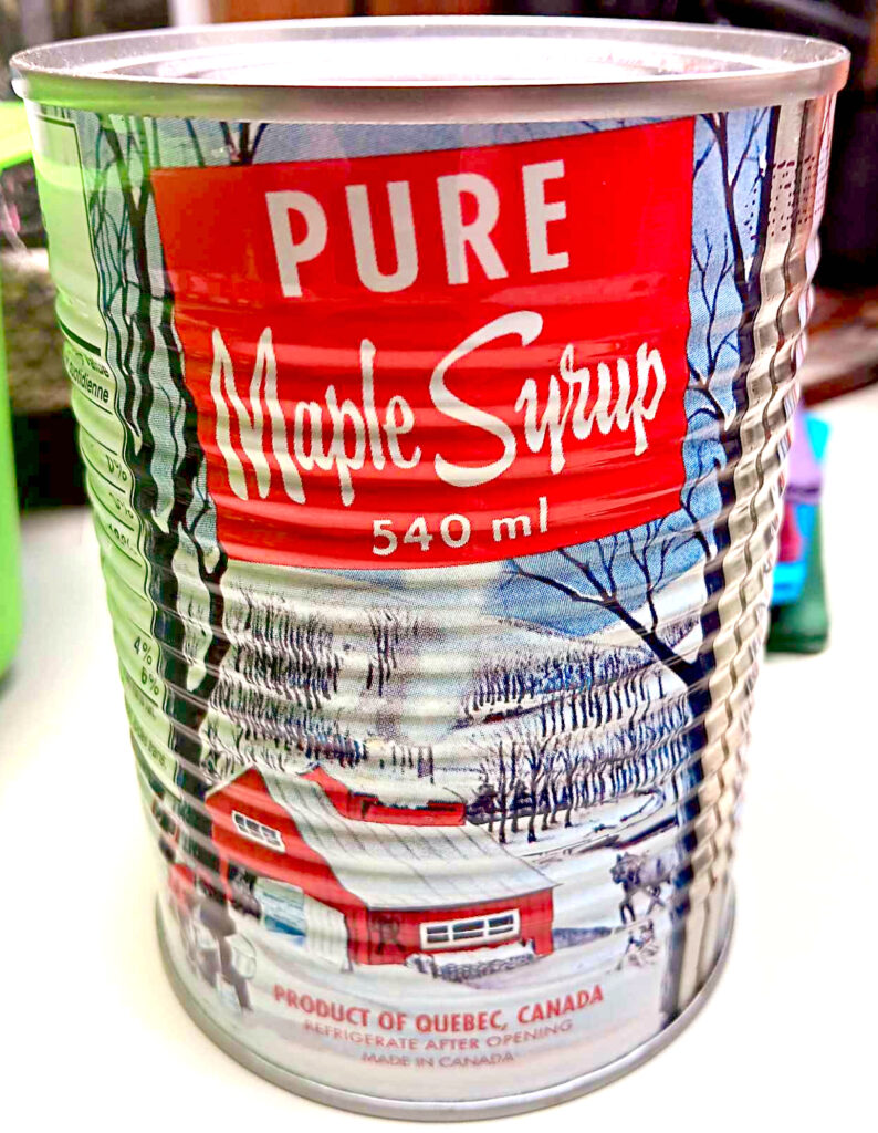 a metal can of maple syrup from Canada written in English