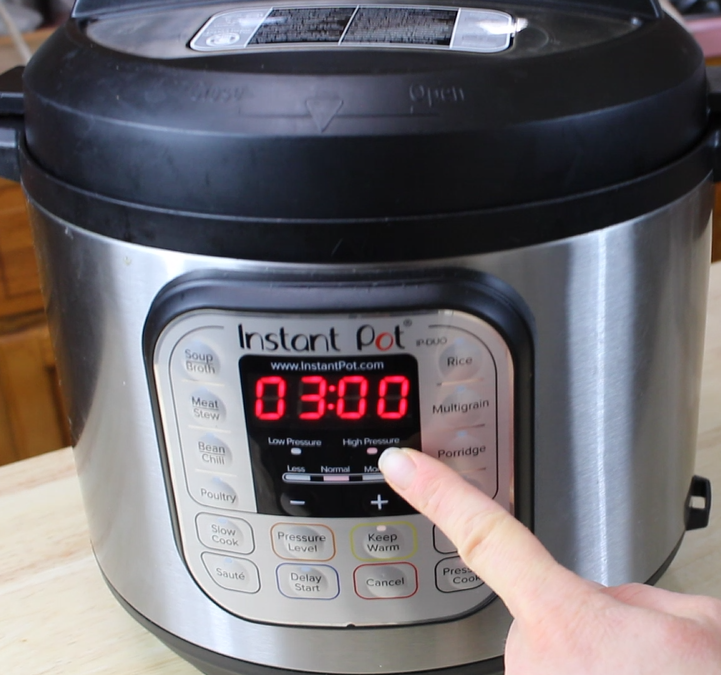 the front panel of an instant pot showing the high pressure light