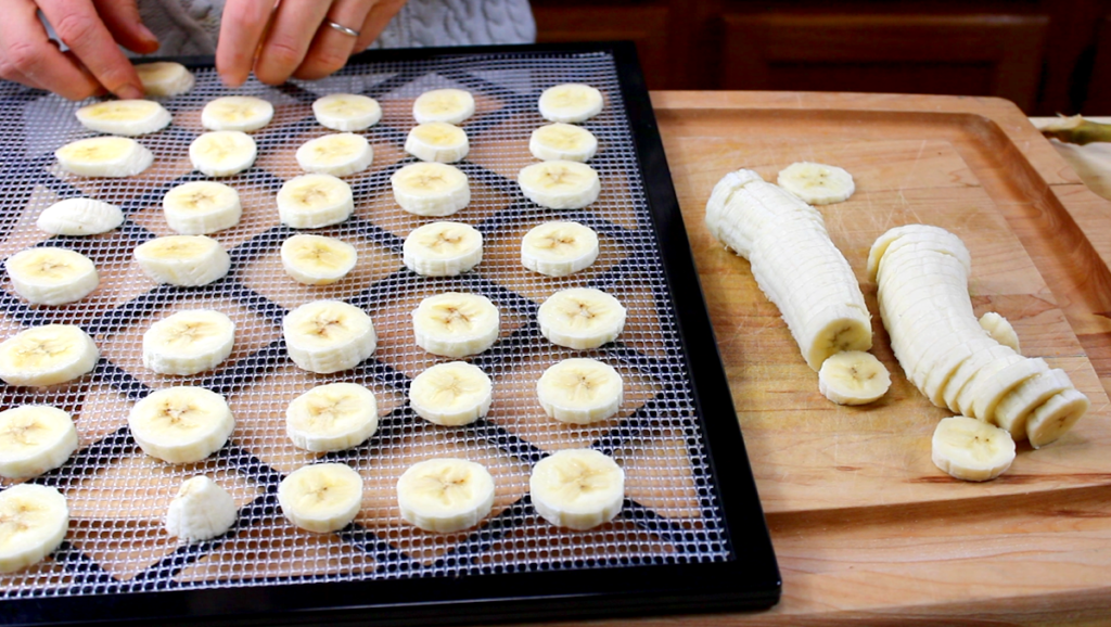 fresh bananas sliced and laid out on a dehydrator tray