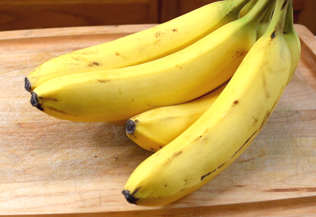 ripe bananas with some small brown spots