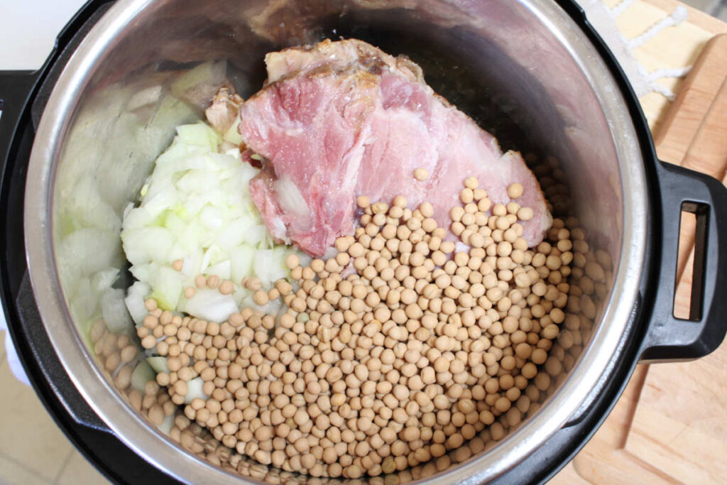 slow cooker ham and pea soup - left over ham bone and whole peas in pot to be cooked