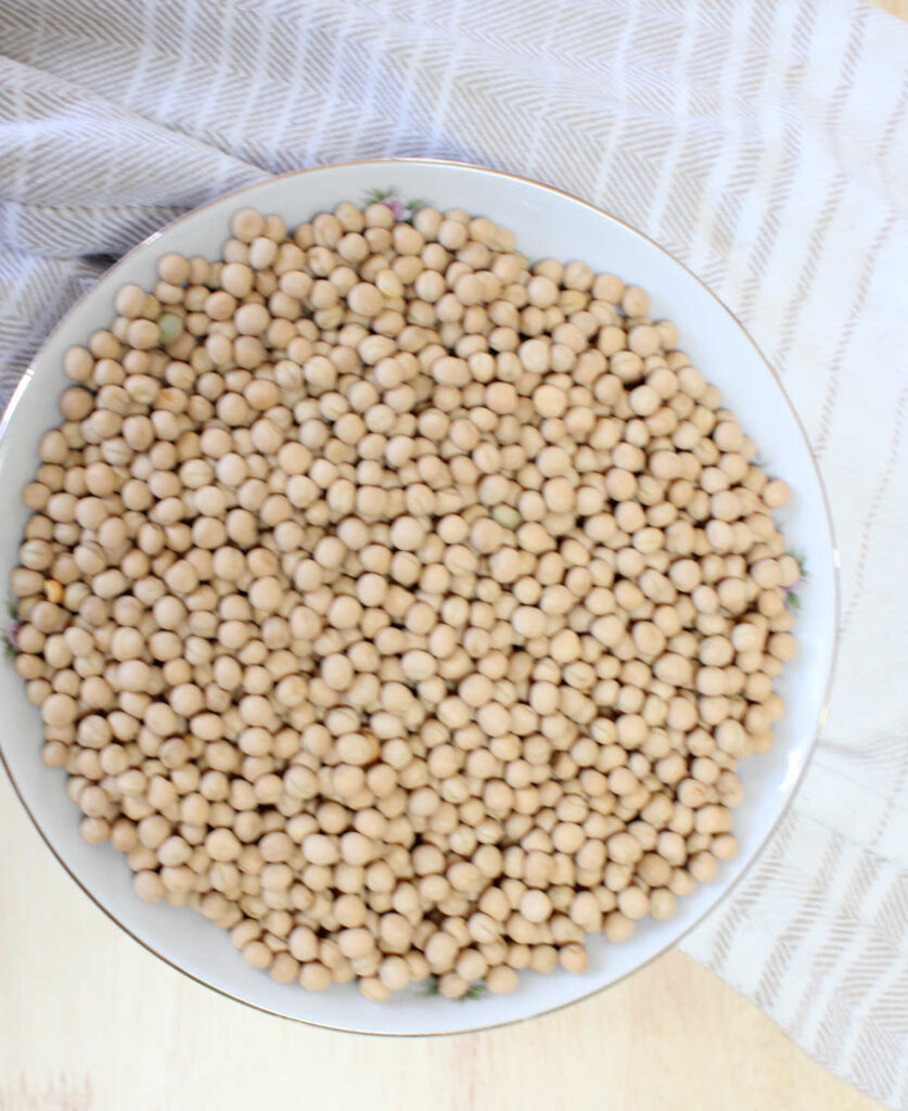 a bowl of uncooked yellow peas in a bowl